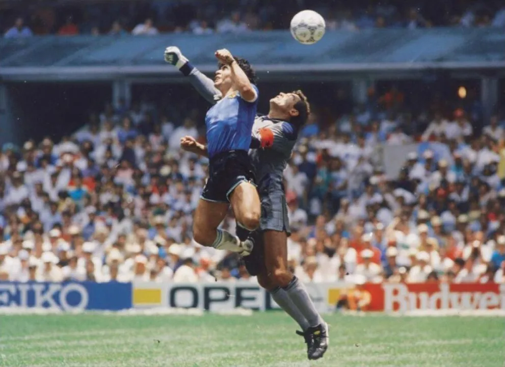 Diego Maradona scores with his hand over goalie Shilton in the 1986 World Cup
